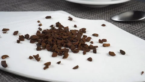 Instant chicory root granules on a white paper empty filter bag on a kitchen  Stock Footage 152618759