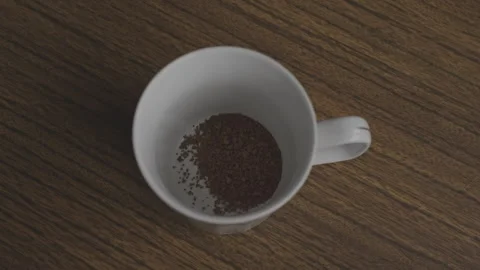 Instant coffee being poured into empty white mug on wooden table, top close up Stock Footage 275170745