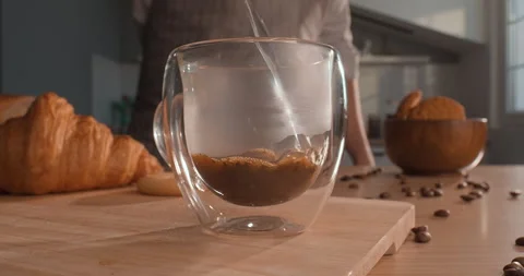 Instant coffee. Boiling water is poured into a cup with instant coffee Stock Footage 243518304