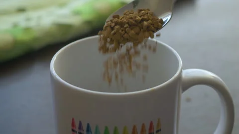 Instant Coffee Pieces Falling From Spoon in Slow Motion in Cup. Fresh Morni.. Video stock 321424730