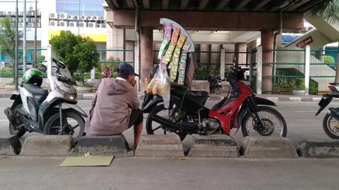 Instant coffee seller using a motorcycle Stock Footage 142250371