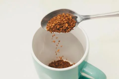 Instant coffee on spoon Stock Photos