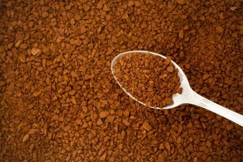 Instant coffee on spoon Stock Photos