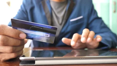 Instant easy mobile payments making purchase in online store Young man paying Stock-Footage 265928407