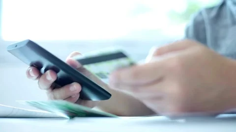 Instant easy mobile payments making purchase in online store Young woman payi Stock Footage 265933612