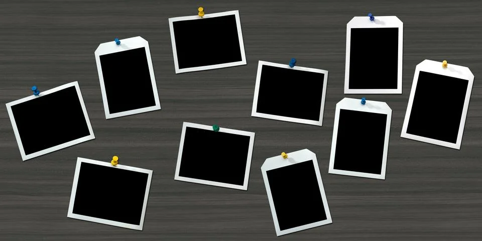 Instant frames hang on wall with colored pins Stock Photos
