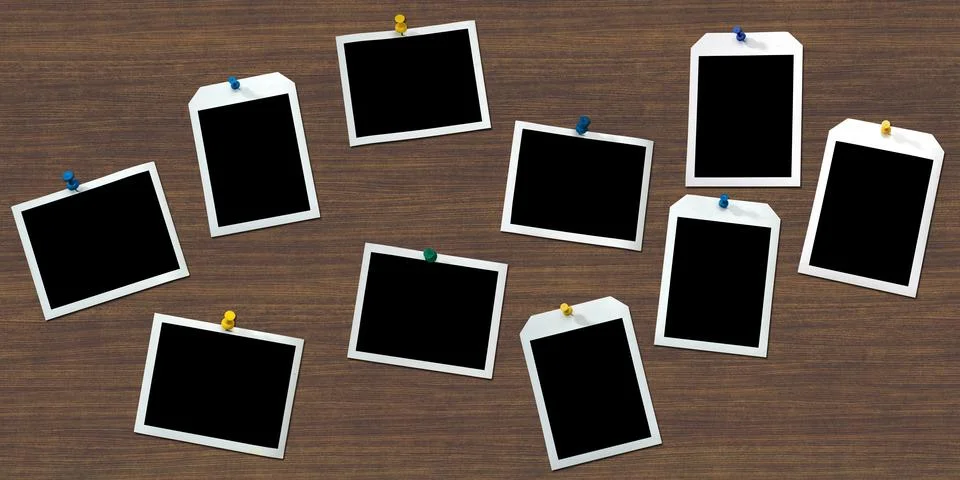 Instant frames hang on wall with colored pins Stock Photos