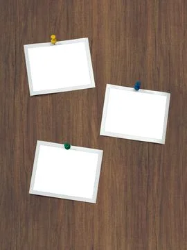 Instant frames hang on wall with colored pins Stock Photos