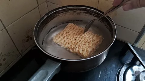 Instant noodles cooking inside boiling water Stock Footage 343171964