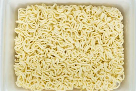 Instant noodles in rectangle plastic plate, top view Stock Photos