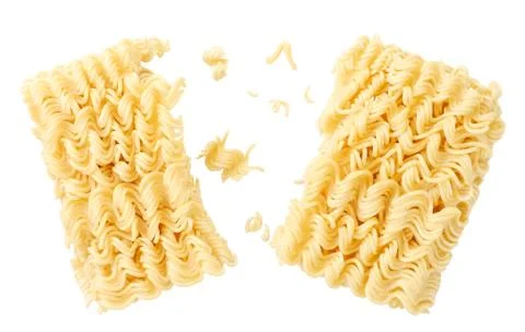 Instant noodles split in half on a white plate. Levitating noodles Stock Photos