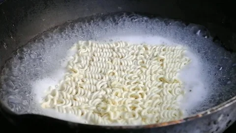 Instant noodles were boiled in water boiling. Stock Footage