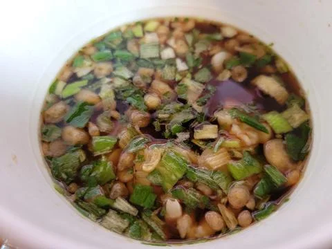 Instant soup in broth in white container with vegetables Stock Photos