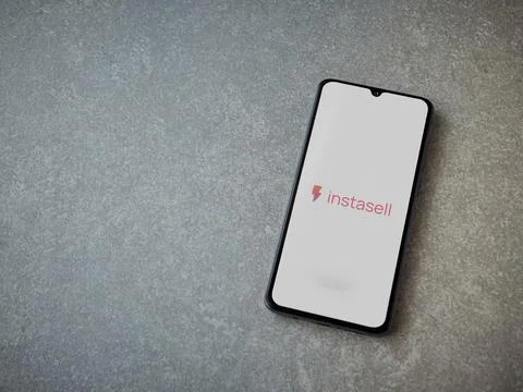 Instasell app launch screen on smartphone on ceramic stone background Stock Photos