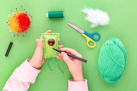 Instruction step by step, step ten. The process of sewing a toy from felt Stock Photos
