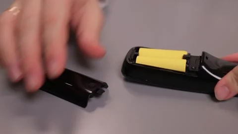 Instructional process of replacing battery in small electronic device Stock Footage 347880356