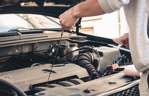 Instructions for changing the oil in the engine. Stock Photos