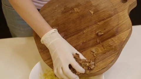Instructions for making pizza. Step Four Cut the pickled mushrooms into pieces Stock Footage 155069580