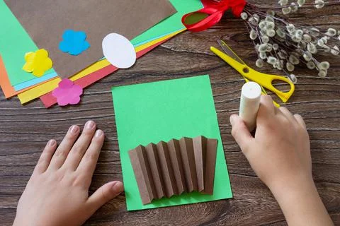 Instructions, step 3. Easter congratulation card with basket easter eggs. Han Stock Photos