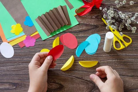 Instructions, step 5. Easter congratulation card with basket easter eggs. Han Stock Photos