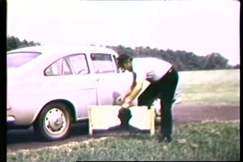 Instructor adjust target board near car - 1965 Stock Footage 106067751