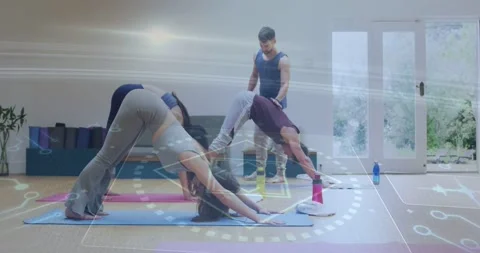 Instructor adjusting right student hip with overlay appearing and guiding yoga 스톡 동영상 331615303