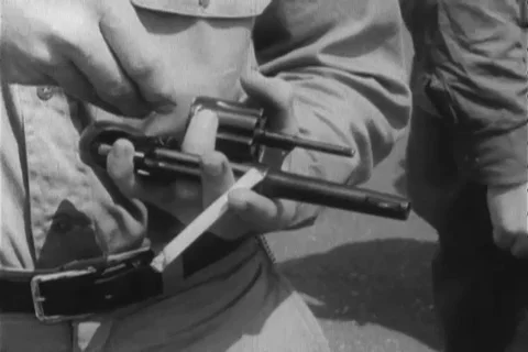 Instructor assist trainee to handle revolver during training - 1960 Stock Footage 106068089