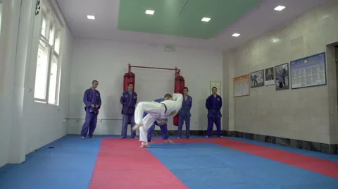 Instructor blockades and throws his assistant by Pakito,slow motion,crane shot Stock Footage 63147126