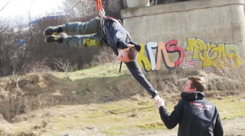 Instructor catches the hand coming down on the rope climber Stock Footage 60443662