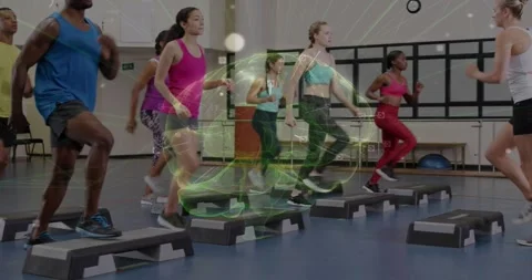 Instructor cue starting class doing high-knee steps on steps green overlay Stock Footage 330397039