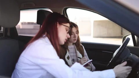 Instructor demonstrates steering technique to student 스톡 동영상 332872075