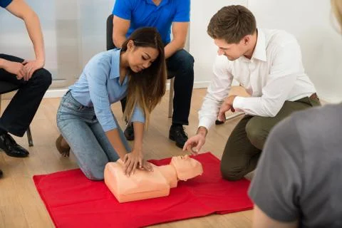Instructor Demonstrating Cpr Chest Compression On A Dummy 写真素材