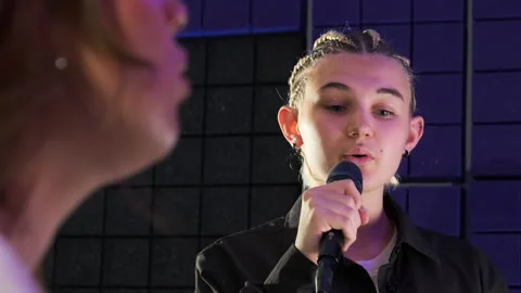 Instructor empowers student to excel in vocal through guidance Stock Footage 307028332