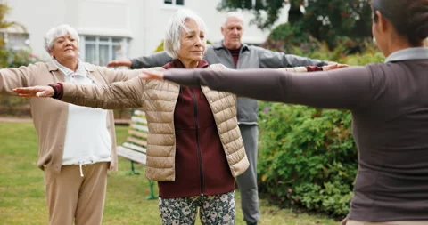 Instructor, exercise and senior people outdoor for wellness, movement and warm Stock Footage 341098884