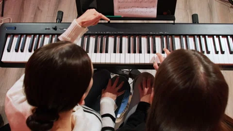 Instructor explains tone of piece by showing gestures Video stock 277677549