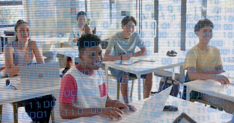 Instructor gesturing toward tablet, initiating coding with binary overlay while Stock Footage 317592232