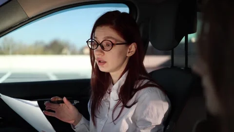 Instructor gives feedback during driving lesson Video stock 332872034