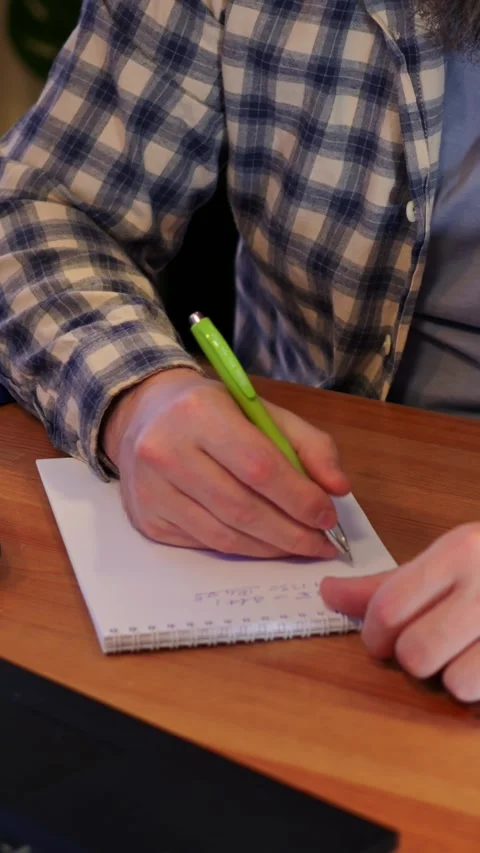 Instructor guides student. Educator supports learner during notetaking Video stock 344729374