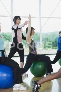 Instructor guiding fitness class Stock Photos