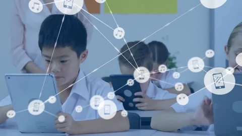 Instructor guiding students using tablets in class, displaying floating music Stock Footage 330337311