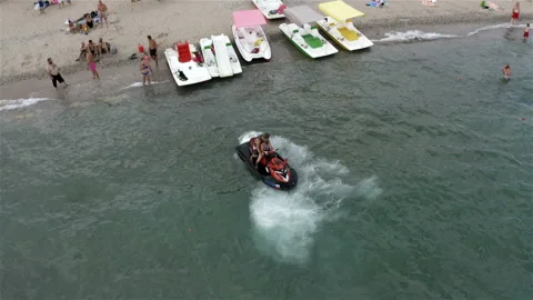 The instructor on a jet ski brought the guy to the shore Stock Footage 146242886