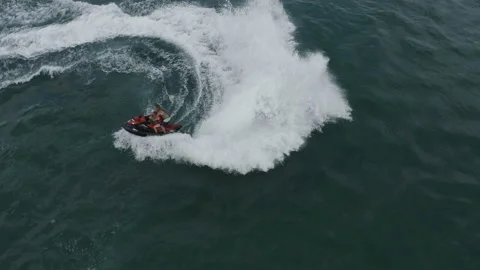 Instructor on a jet ski makes sharp turns Stock Footage 146242578
