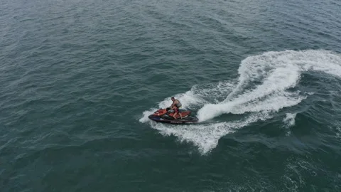 Instructor on a jet ski shows sharp turns Stock Footage 146244174