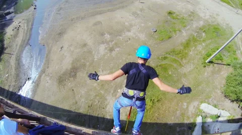 Instructor makes test jump from bridge Stock Footage 53350348