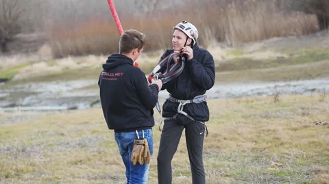 Instructor meets a man at the bottom, landed after the jump Stock Footage 60443695
