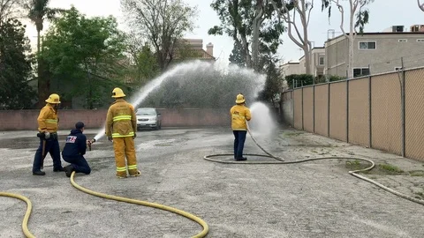 Instructor performing training exercises with firefighters in Los Angeles, 4K Stock Footage 102149220