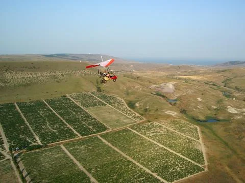 The instructor pilot and passenger sit in a hang glider Stock Photos