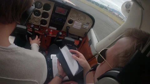 Instructor Pilot  Checking Documents Before Flight - close up shot Video stock 202022635