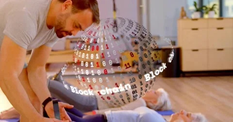 Instructor pressing knee launching rotating blockchain sphere while aiding leg Stock Footage 329772345