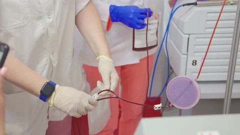 Instructor shows automated cell blood processor Stock Footage 234815427